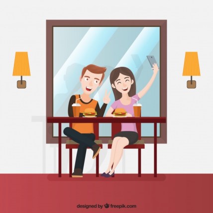 young-friends-taking-a-selfie-in-restaurant_23-2147662119